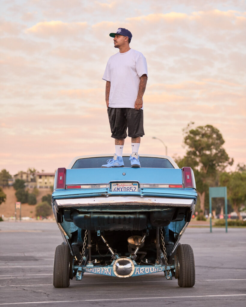 © Owen Harvey, 'Erik, standing on top of his Cutlass, outside the Rosebowl, Pasadena.'