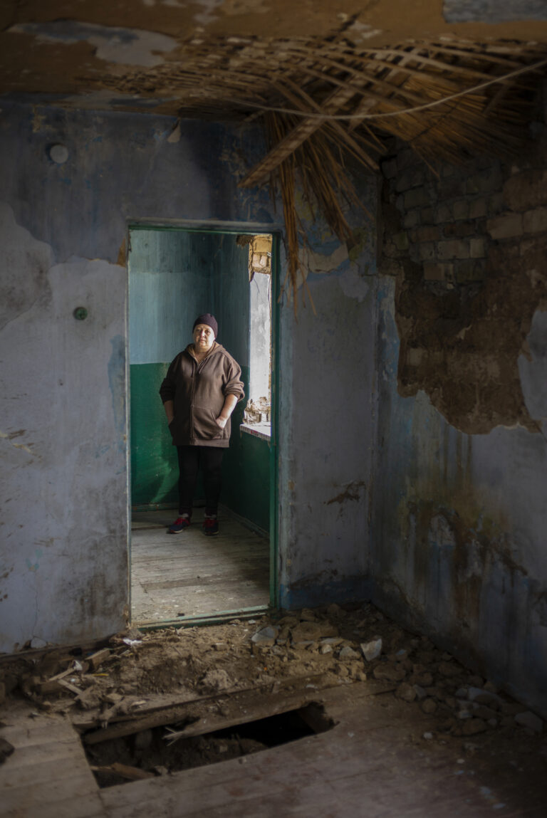 Mother looking at the spot where a Russian missile killed her 8 year old daughter, Kherson frontlines. © Danny Burrows